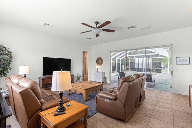 tiled living room with ceiling fan