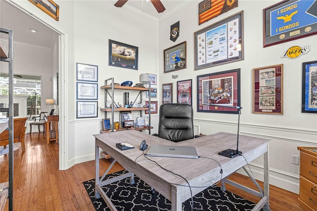 office space featuring crown molding, ceiling fan, and wood-type flooring