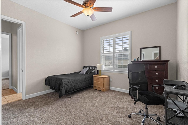 carpeted bedroom featuring ceiling fan