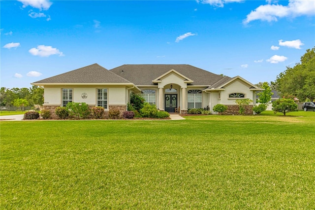 ranch-style home featuring a front yard