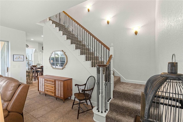 staircase with recessed lighting and baseboards