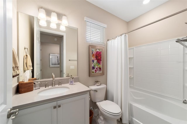 full bathroom featuring toilet, vanity, and shower / bath combo with shower curtain