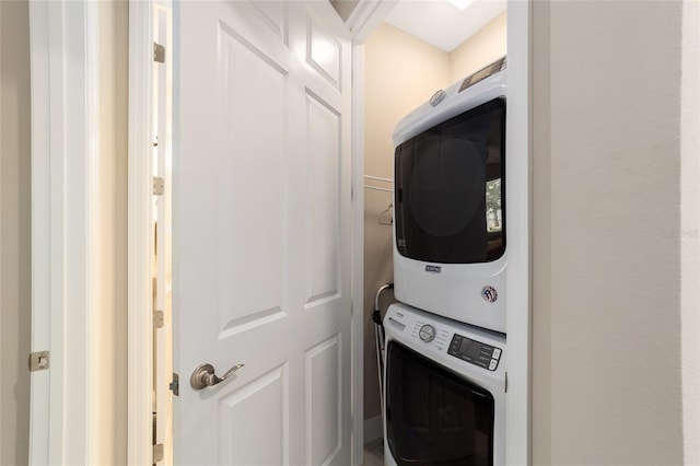 laundry area with stacked washer and clothes dryer