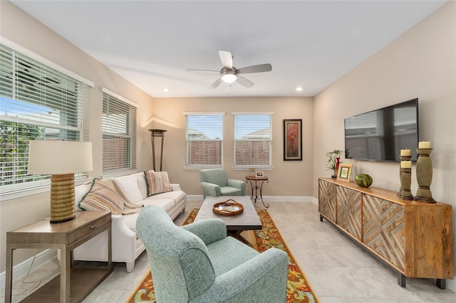 living room with ceiling fan and light tile patterned flooring