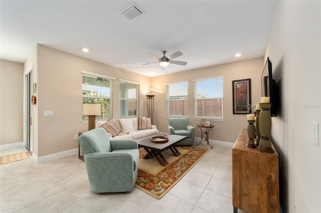 tiled living room with ceiling fan