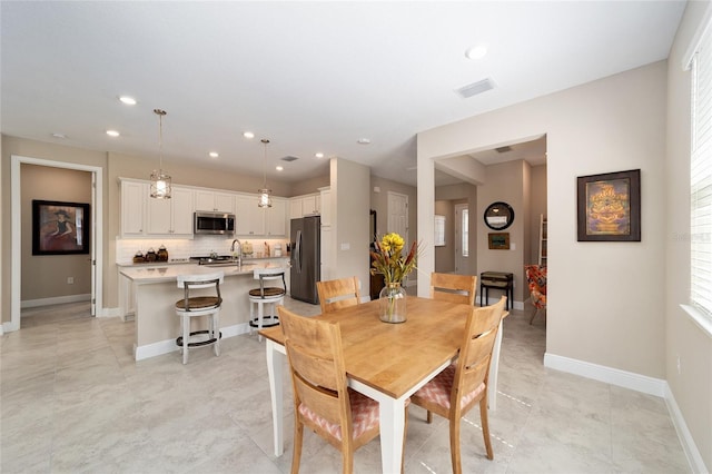 dining room featuring sink