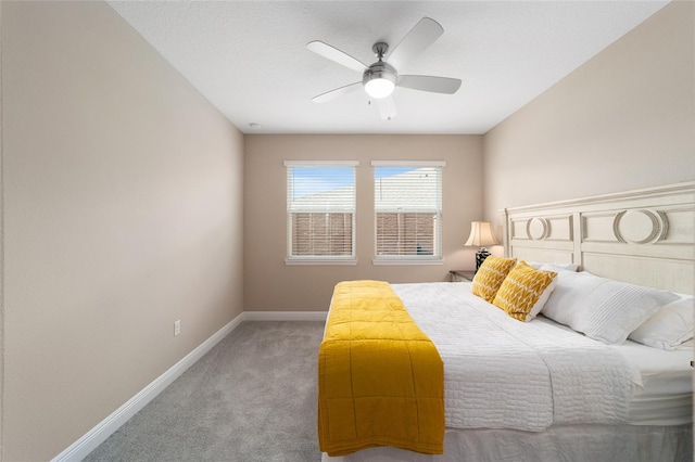 bedroom with ceiling fan and carpet flooring