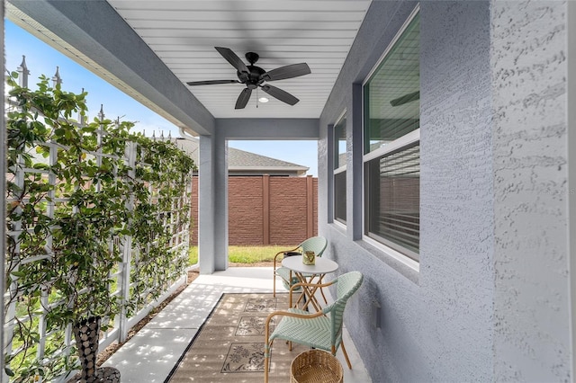 view of patio featuring ceiling fan