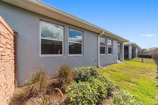 view of side of property featuring a yard