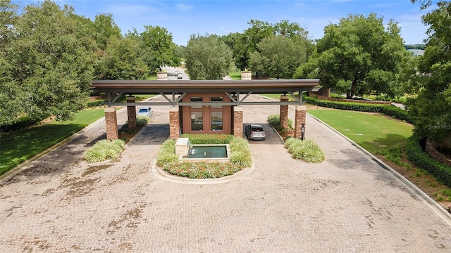 view of home's community featuring a lawn