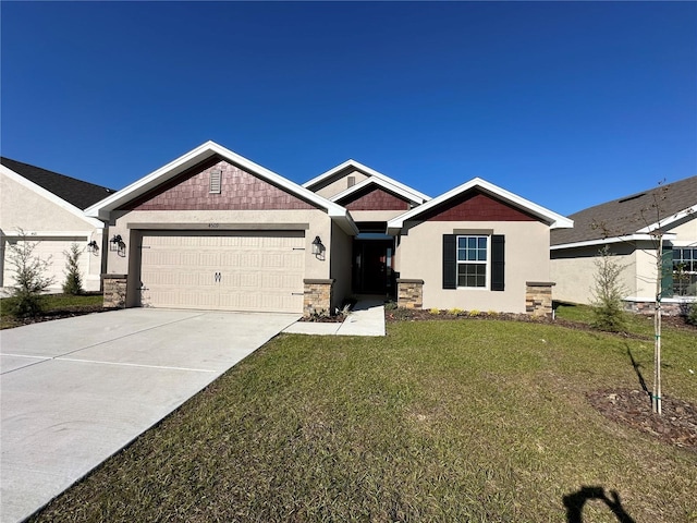 craftsman house featuring a front yard and a garage