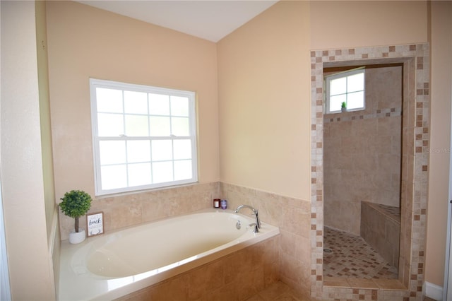 bathroom featuring plus walk in shower