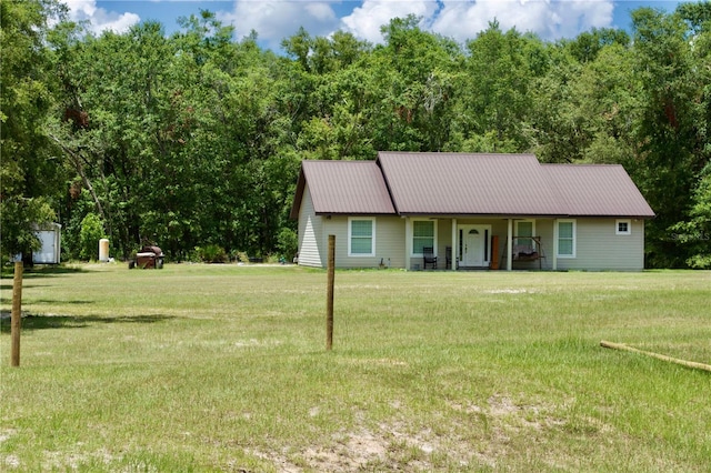 view of front of property with a porch and a front lawn