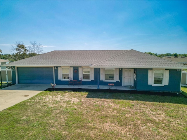 ranch-style home with a garage, a front lawn, and a porch