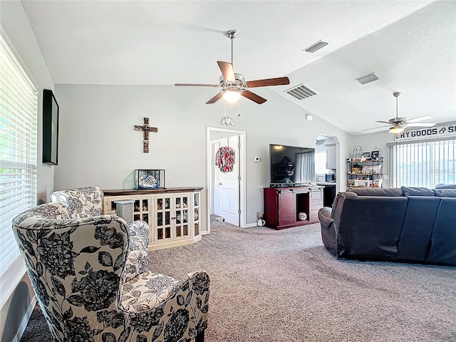 living room featuring vaulted ceiling, carpet floors, and ceiling fan