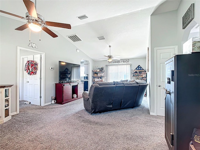 carpeted living room with lofted ceiling and ceiling fan