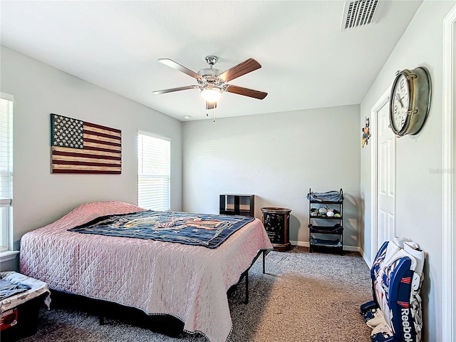 carpeted bedroom with ceiling fan