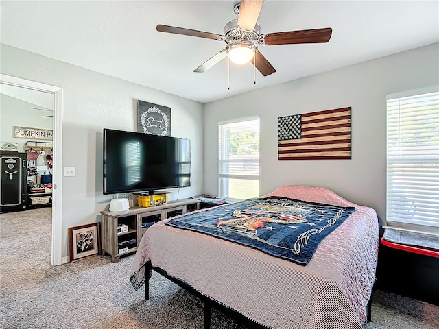 carpeted bedroom with ceiling fan