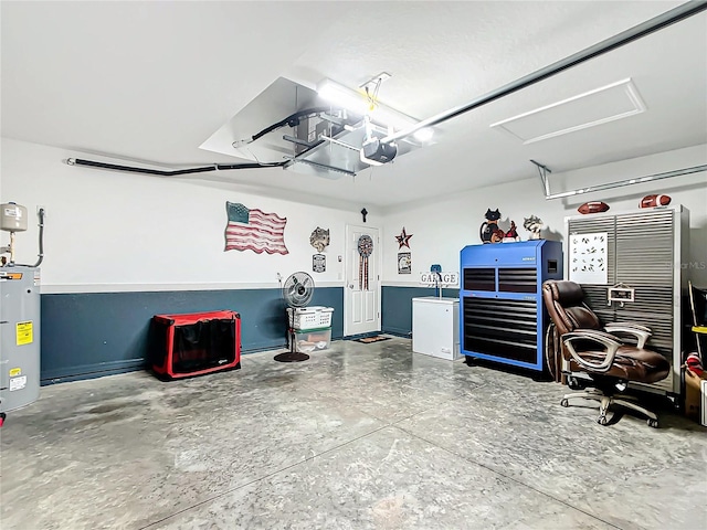 garage featuring refrigerator and water heater