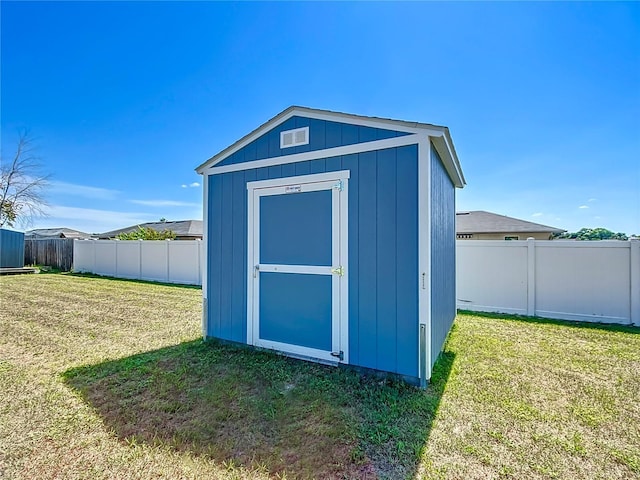 view of outdoor structure with a lawn