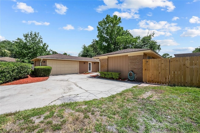 view of front of home with a front lawn and a garage