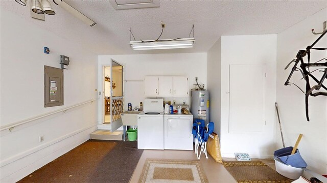 garage with electric water heater, electric panel, and independent washer and dryer