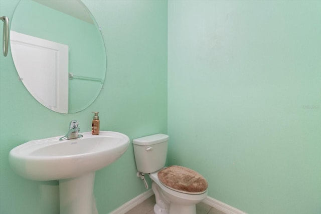 bathroom featuring toilet and tile patterned floors