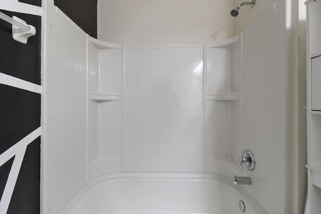 bathroom with washtub / shower combination