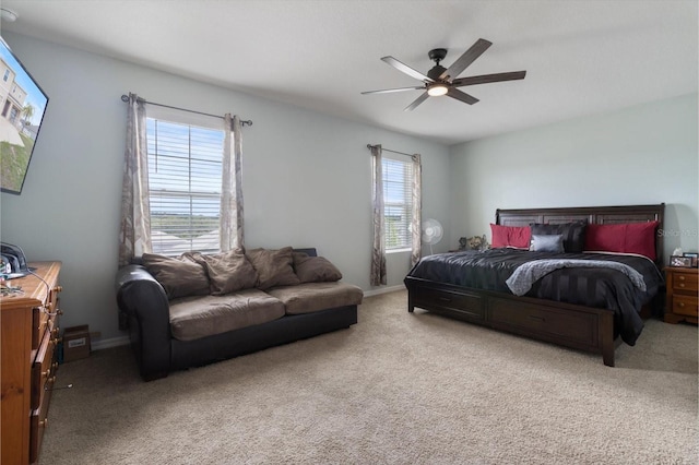 bedroom with ceiling fan and carpet flooring