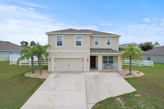 front of property featuring a garage, a front yard, and a porch