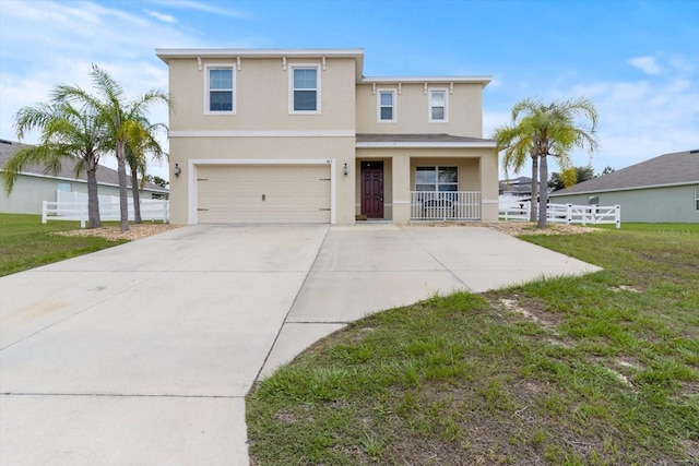 view of front of house with a front lawn, a garage, and covered porch