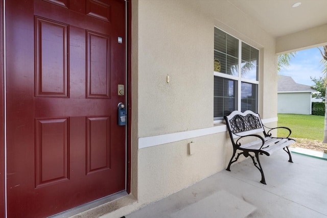 property entrance featuring a porch