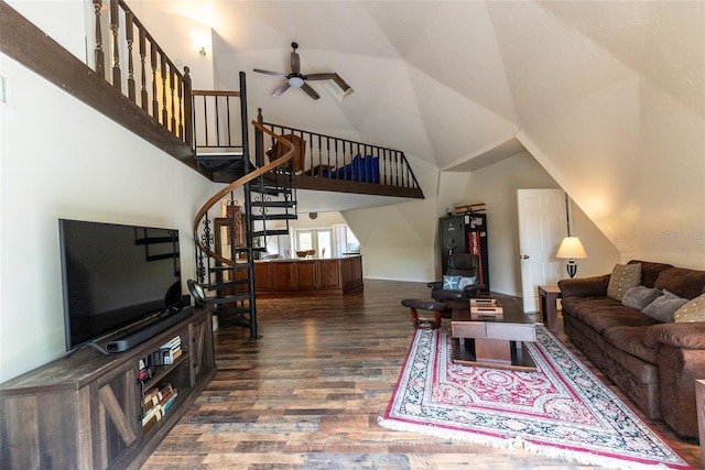 living room featuring ceiling fan, lofted ceiling, and dark wood-type flooring