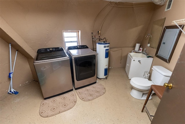 laundry room featuring washing machine and clothes dryer, sink, and water heater