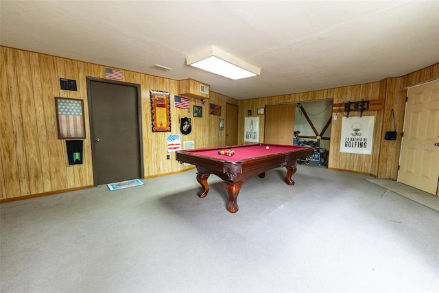 rec room featuring light carpet, wooden walls, and billiards