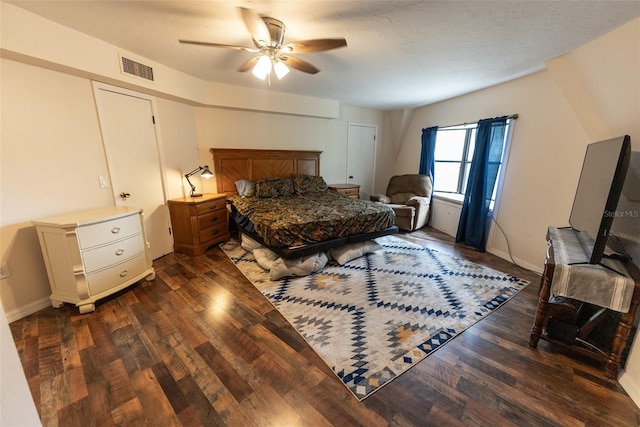 bedroom with ceiling fan and dark hardwood / wood-style floors