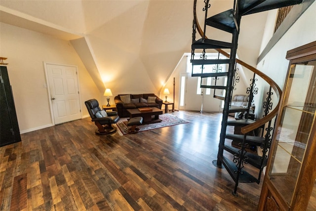 living room featuring lofted ceiling and dark hardwood / wood-style floors