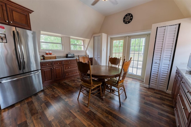 dining area featuring ceiling fan, dark hardwood / wood-style flooring, high vaulted ceiling, and french doors