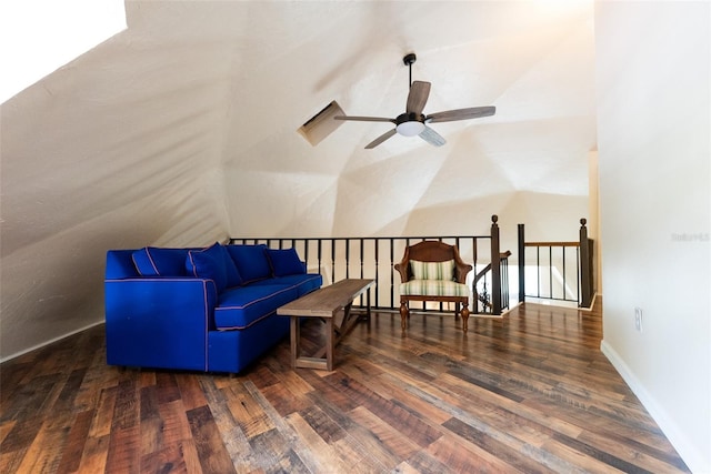 sitting room with dark hardwood / wood-style floors, ceiling fan, and vaulted ceiling