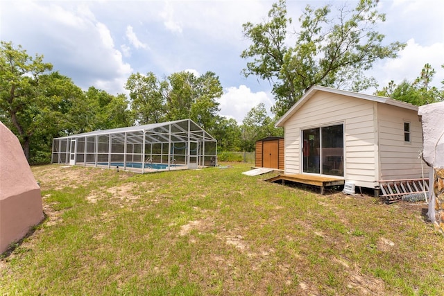 view of yard with a storage unit and a lanai