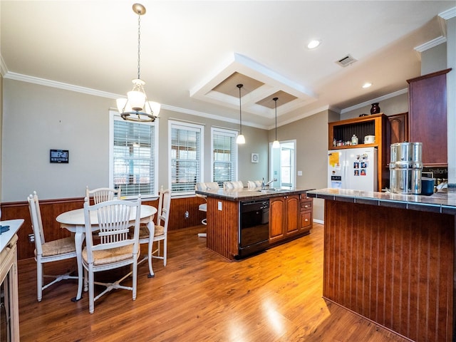 kitchen with white fridge with ice dispenser, plenty of natural light, black dishwasher, and light hardwood / wood-style flooring