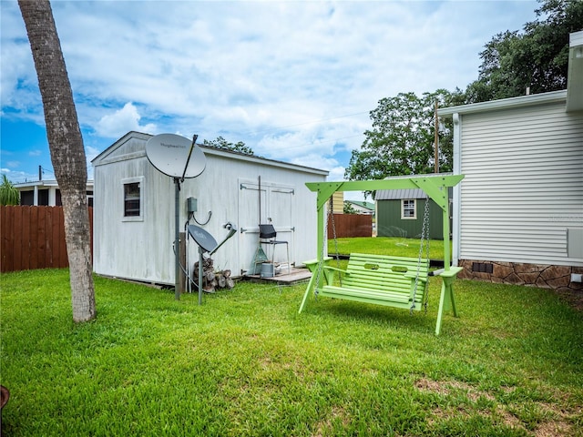 view of yard with a storage unit