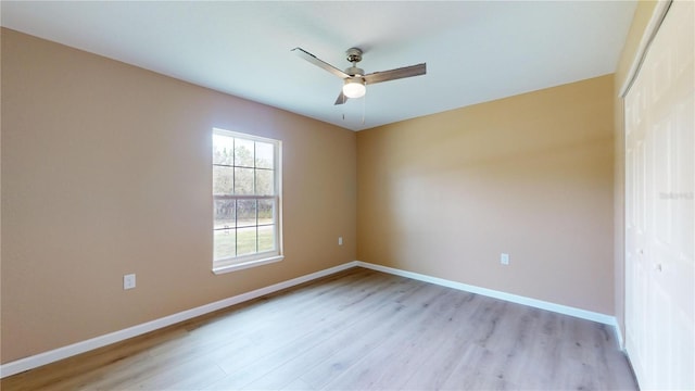 unfurnished room with light hardwood / wood-style flooring and ceiling fan