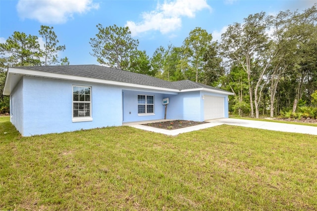 ranch-style house featuring a garage and a front yard