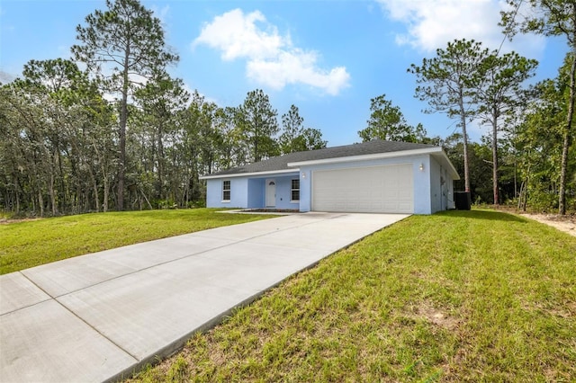 ranch-style house with a garage, central AC, and a front yard