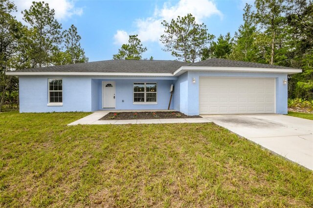 ranch-style home with a garage and a front lawn