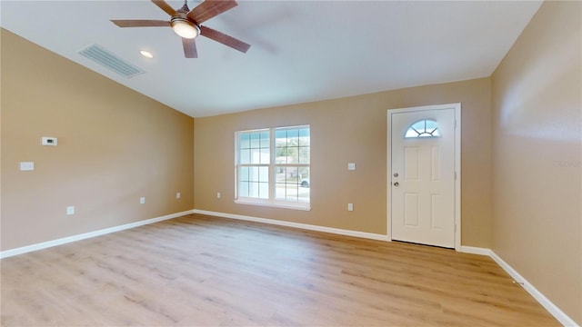 foyer with vaulted ceiling, ceiling fan, and light hardwood / wood-style flooring