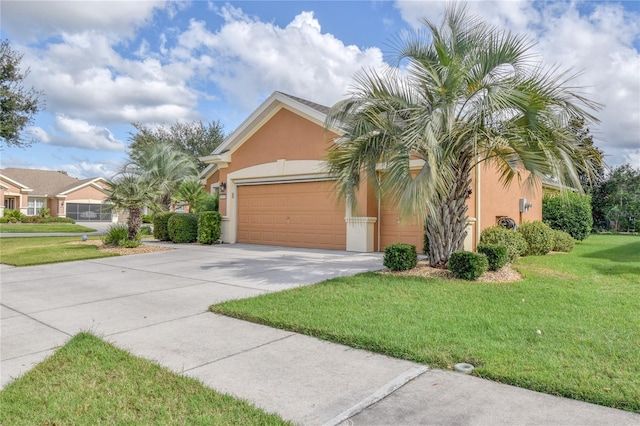 view of front of home with a garage and a front yard