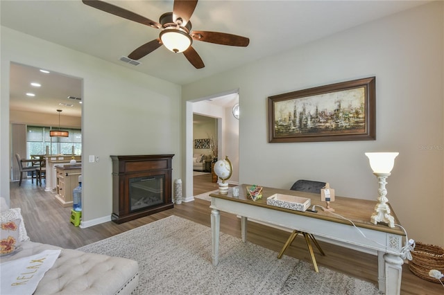 office space featuring ceiling fan and hardwood / wood-style floors