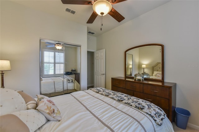 bedroom with ceiling fan, a closet, and lofted ceiling